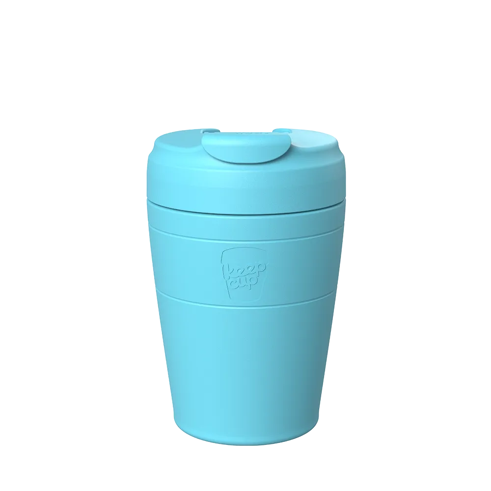Light blue reusable coffee cup with lid and silicone grip band, KeepCup brand logo visible on side