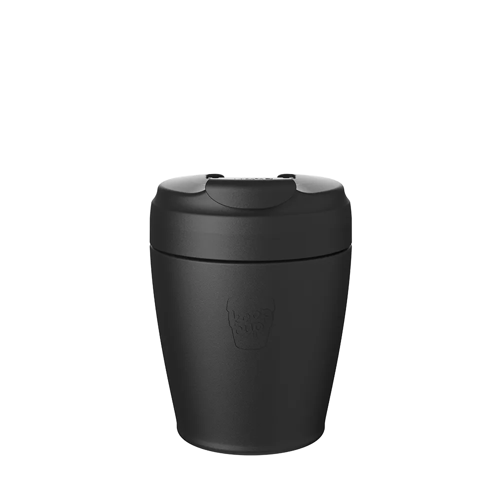 Black reusable coffee cup with lid and spout for takeaway drinks on white background