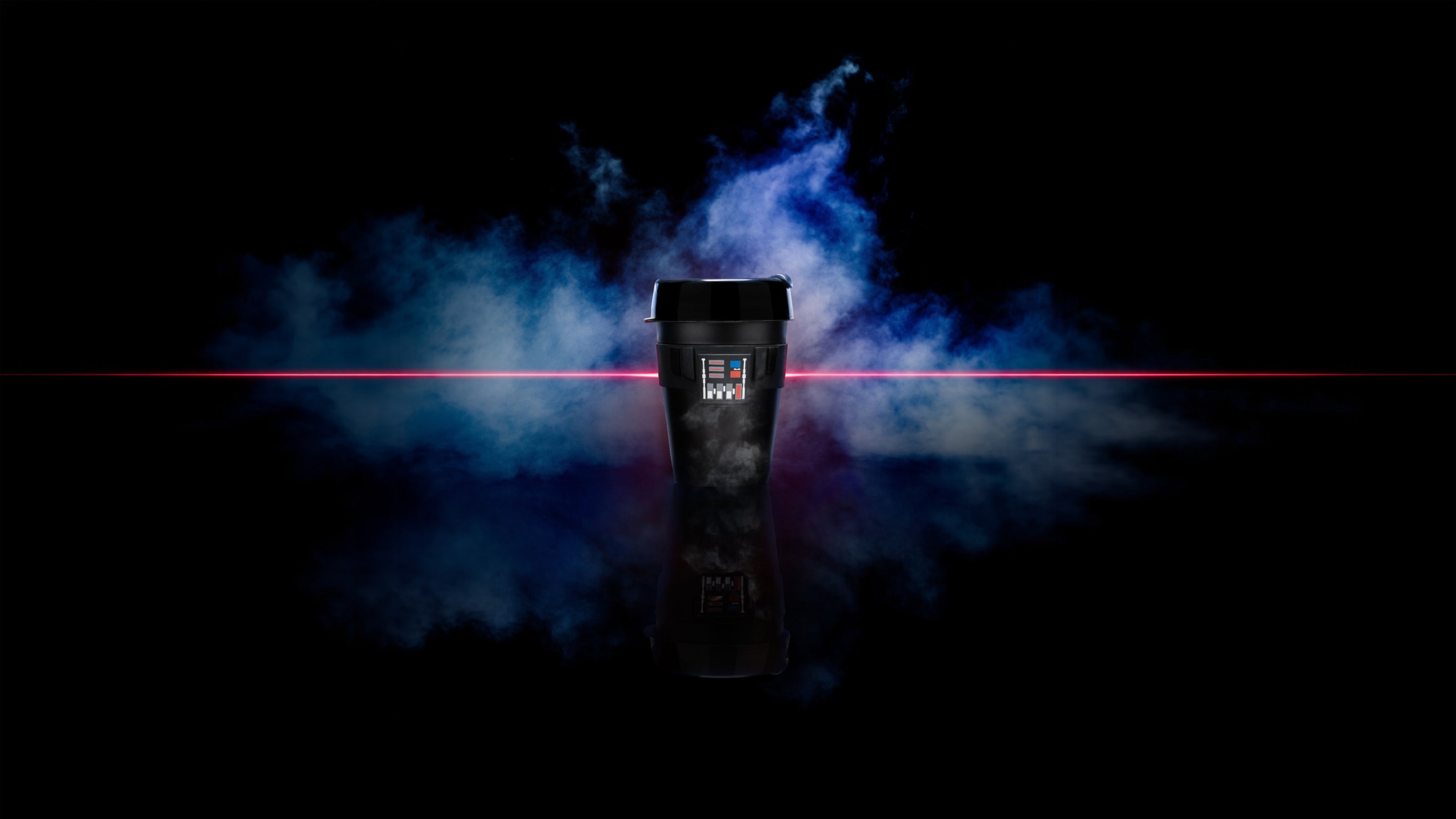 Black cylindrical device with blue and purple smoke effects and red laser beam on dark background