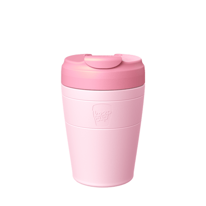 KeepCup Commuter M 12oz in Pashmak Pink, shown in a front-facing studio shot against a white background, featuring a pashmak cup with a peony lid and flip-top drinking closure.