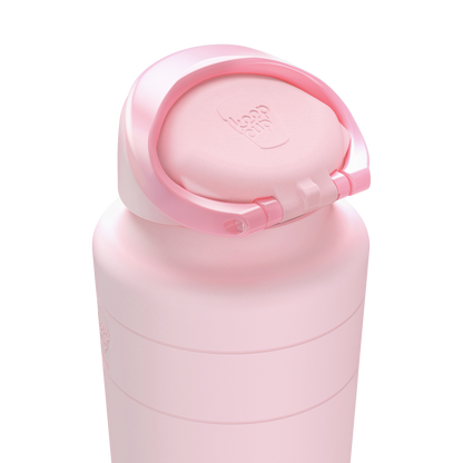 Close-up of the KeepCup Ora Bottle in Pashmak Pink showing the flip-top lid open, featuring the embossed KeepCup logo on the cap and the soft matte pink finish of the insulated stainless steel body.