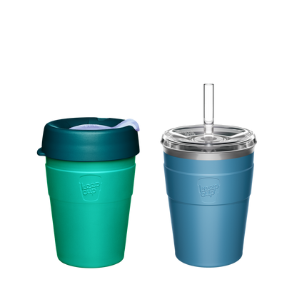 Two KeepCup reusable coffee cups - left cup is teal and green with silicone lid, right cup is blue with clear straw lid