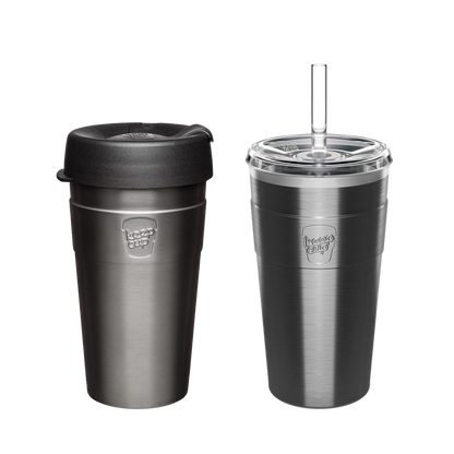 Two stainless steel KeepCup travel mugs in gunmetal gray - one with black silicone lid, one with clear straw lid