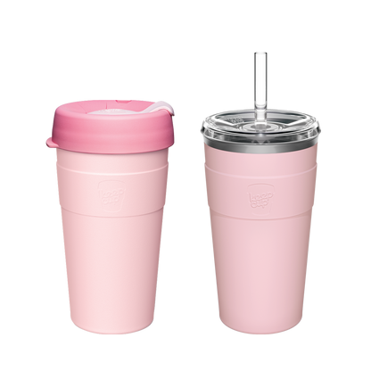 Two pink reusable travel cups - one collapsible coffee cup with darker pink lid and one insulated tumbler with straw and clear lid