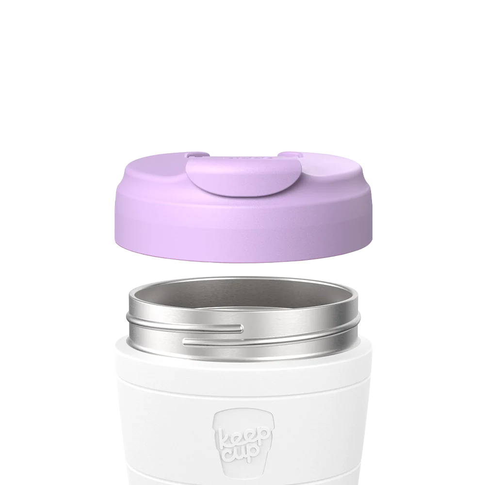 Exploded view of KeepCup Commuter Flip Lid in Lilac hovering above a white KeepCup body with stainless steel rim, showing how the lid attaches to the cup.