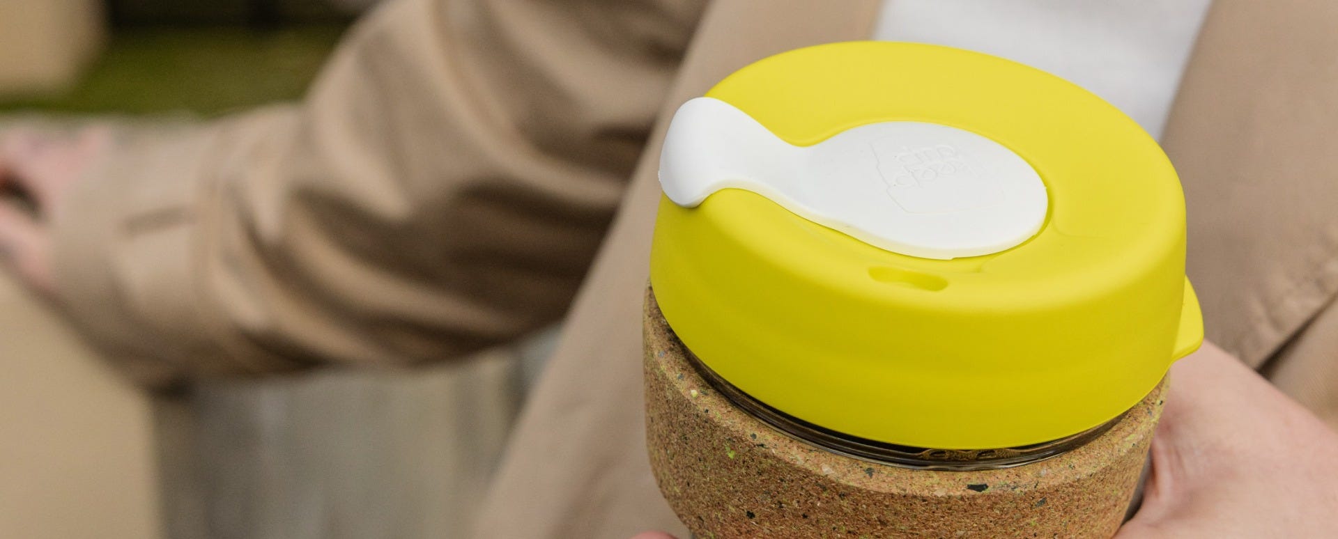Woman holding KeepCup Brew Cork Ace 12oz with coffee