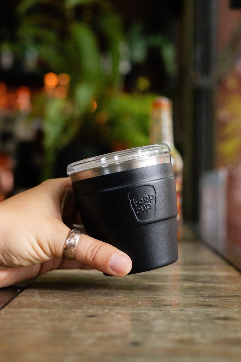 KeepCup Thermal Quicksip XS 6oz sitting on mirror table with lid off