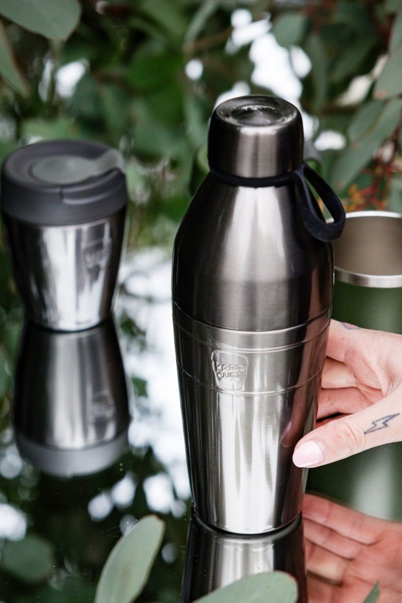 Woman holding KeepCup Traveller Bundle 16oz